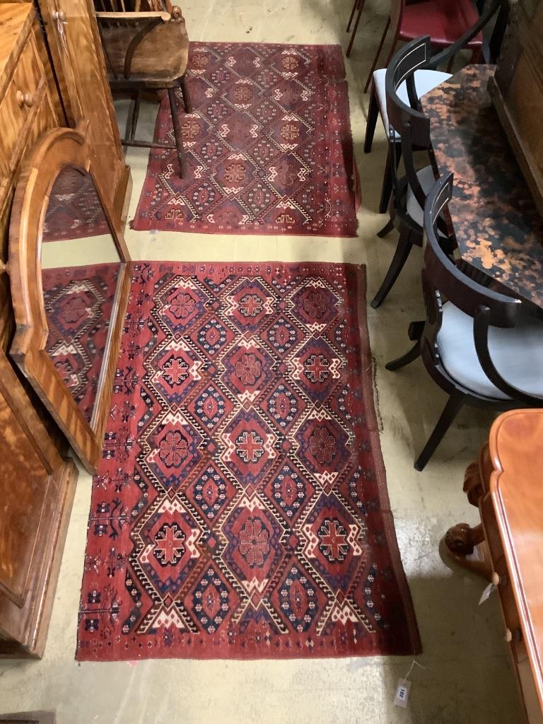 A pair of Caucasian red ground rugs, 154 x 97cm